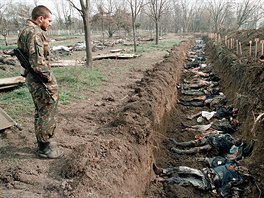 11 Russian Army soldier inspects 31 March 1995 at a cemetery in Grozny, capital...
