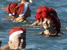 People swim during the traditional Christmas bath in the Mediterranean sea at...