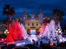 People gather in front of Christmas decorations outside the Casino in  Monaco,...