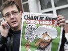 Stphane Charbonnier (Charb) s kontroverznm vydnm Charlie Hebdo, kter vedlo...