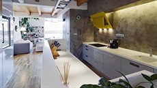 Stěna za kuchyňskou linkou se dobře udržuje díky stěrce v imitaci betonu s...