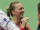 Petra Kvitová se raduje s leny realizaního týmu.