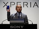 Sony Mobile Communications Inc President and CEO Totoki holds up Sony's new...