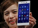 A model poses with Sony's new Xperia Z4 smartphone after a news conference in...