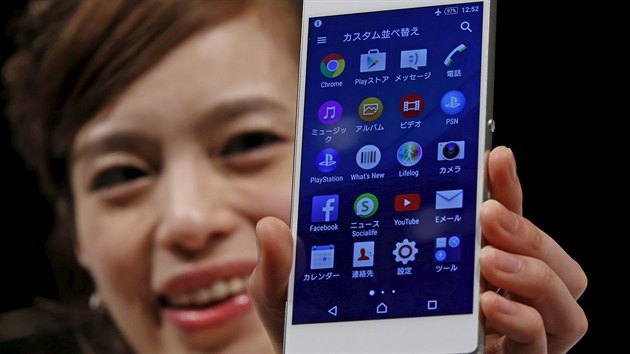 A model poses with Sony's new Xperia Z4 smartphone after a news conference in Tokyo