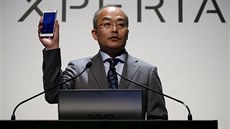 Sony Mobile Communications Inc President and CEO Totoki holds up Sony's new...