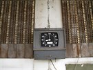 A punch clock is seen at the entrance of a deserted cooking oil factory that...