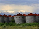 Deserted grain silos are seen in front of the snowcapped Mount Olympus near...