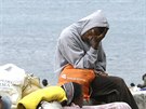 Uprchlíci ekají poblí hraniního pechodu mezi Itálií a Francií. Sousední...