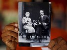 A person's hands are seen holding an archive photograph of Margarita, a Guna...