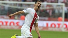 Arkadiusz Milik z Polska a jeho gólová radost v duelu s Gruzií