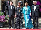 Nmecká kancléka Angela Merkelová se svým muem Joachimem Sauerem (vlevo),...