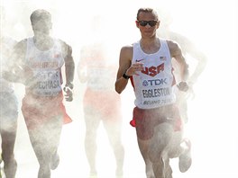 United States' Jeffrey Eggleston runs through a cooling mist station during...