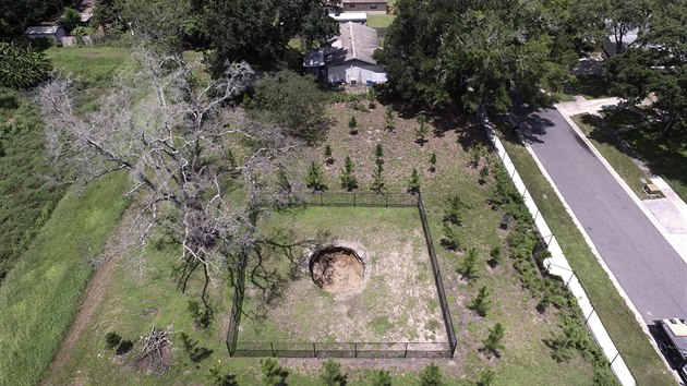 This March 2013 photo shows the sinkhole located at 240 Faithway Dr. in Seffner, Fla. On Wednesday afternoon, Aug. 19, 2015 a 17-foot wide and 20-foot ...