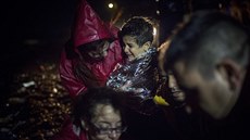 Uprchlíci po vylodní na eckém ostrov Lesbos (26. íjna 2015)