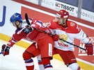 Ruský hokejista Nikita Zajcev (vpravo) atakuje , českého útočníka Tomáše...