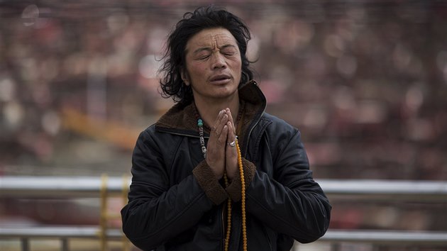 An ethnic Tibetan man prays at a monastery above the Larung Wuming Buddhist Institute, located some 3700 to 4000 metres above the sea level in remote Sertar county, Garze Tibetan Autonomous Prefecture, Sichuan province