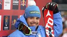 Italský lya Peter Fill se usmívá po absolvování slavného sjezdu v rakouském...