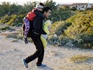 Uprchlíci nedaleko tureckého msta Çeme, odkud odplouvají ecký ostrov Chios...