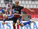 Olomoucký fotbalista Václav Vaíek padá v utkání s Opavou.