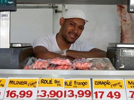 Jeymerson Pereira, a 25-year-old butcher, poses for a portrait in Rio de...