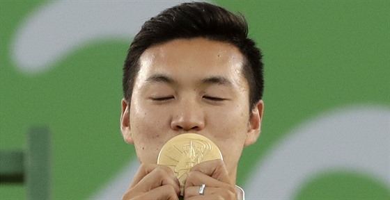 Korejský lukostelec  Ku Pon-chan se zaltou medailí.