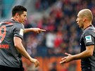 Fotbalisté Bayernu Mnichov Robert Lewandowski a Arjen Robben v utkání německé...