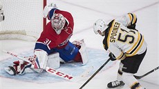 Ryan Spooner z Bostonu dává rozhodující branku v prodlouení duelu s...