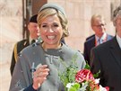 Královna Maxima loni pi návtv Bavorska oblékla kabát zdobený svastikou....