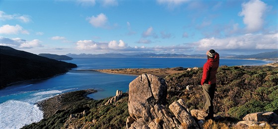 Rakiura Track. Stewart Island - Hiker overlooking Bay