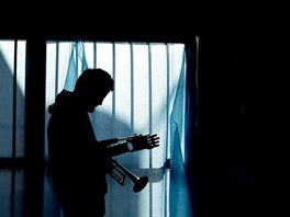 In this May 30, 2017 photo, Juan Pablo Pelaez prepares to play his trumpet...