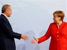 Podání ruky v podání tureckého prezidenta Recepa Tayyipa Erdogana a německé...