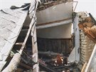 Fotografie trosek domu, kter rodin ikovch z Troubek v roce 1997 zniila...