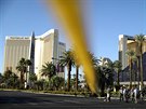 News crews stand in front of the closed Las Vegas Strip next to the site of the...