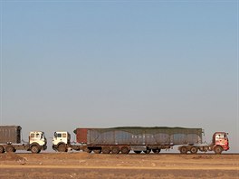 Thousands of heavy-duty trucks loaded with coal are lined up for up to 130...