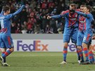 Plzetí fotbalisté Petrela (zleva), Chorý, Hoava se radují z gólu, který...