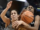 Connecticut's Kia Nurse, left, fights for a rebound with Temple's Breanna Perry