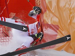 Austria's Manuel Feller crashes during the first run of the men's giant slalom...