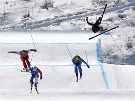 Christopher Del Bosco of Canada, right, flies through the air before crashing...