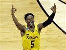 Jourdan Grant z UMBC se raduje z trefy proti Virginii.