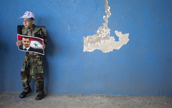 Golanské výšiny. Drúzský chlapec s portrétem syrského prezidenta Bašára Asada...