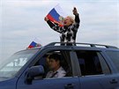 Rusové oslavují zprovoznní Krymského mostu, který spojil ruskou pevninu s...