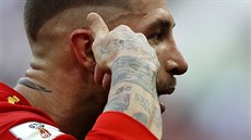 Spain's Sergio Ramos gestures as he celebrates after Spain score the opening...