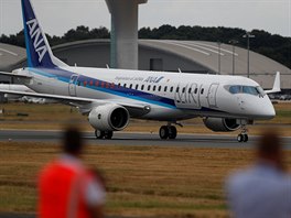 An MRJ is watched after a display at the Farnborough Airshow, in Farnborough