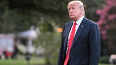 U.S. President Donald Trump walks from Marine One as he returns to the White...