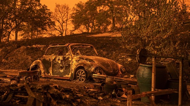 A Volkswagen Beetle scorched by a wildfire called the Carr Fire rests
at a residence in Redding, Calif., Friday, July 27, 2018. The wildfire
roared with little warning into the Northern California city as
thousands of people scrambled to escape before the walls of flames
descended from forested hills onto their neighborhoods, officials said
Friday.