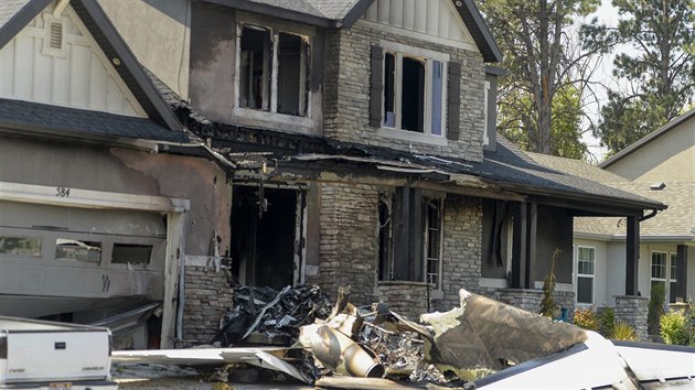 This photo shows a damaged house after a plane crashed in Payson, Utah, Monday, Aug. 13, 2018. A Utah man flew the small plane into his own house earl ...