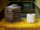 A toilet paper roll is pictured next to 2,600,000 bolivars, its price and the...