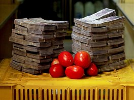 A kilogram of tomatoes is pictured next to 5,000,000 bolivars, its price and...