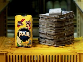 A package of 1kg of corn flour is pictured next to 2,500,000 bolivars, its...